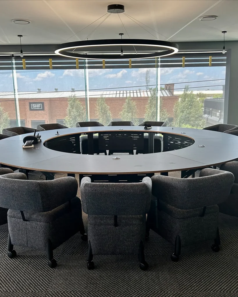 Round boardroom table on steel base, boardroom tables